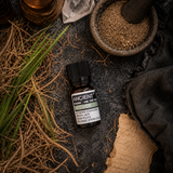 10 ml Vetivert Essential Oil — overhead lifestyle flat lay