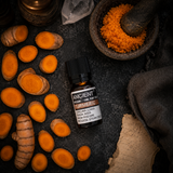Turmeric Essential Oil 10ml — overhead lifestyle flat lay