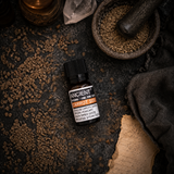 10 ml Carrot Seed Essential Oil — overhead lifestyle flat lay