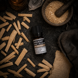 10 ml Ho Wood Essential Oil — overhead lifestyle flat lay