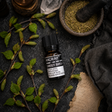 10 ml Sweet Birch Essential Oil — overhead lifestyle flat lay